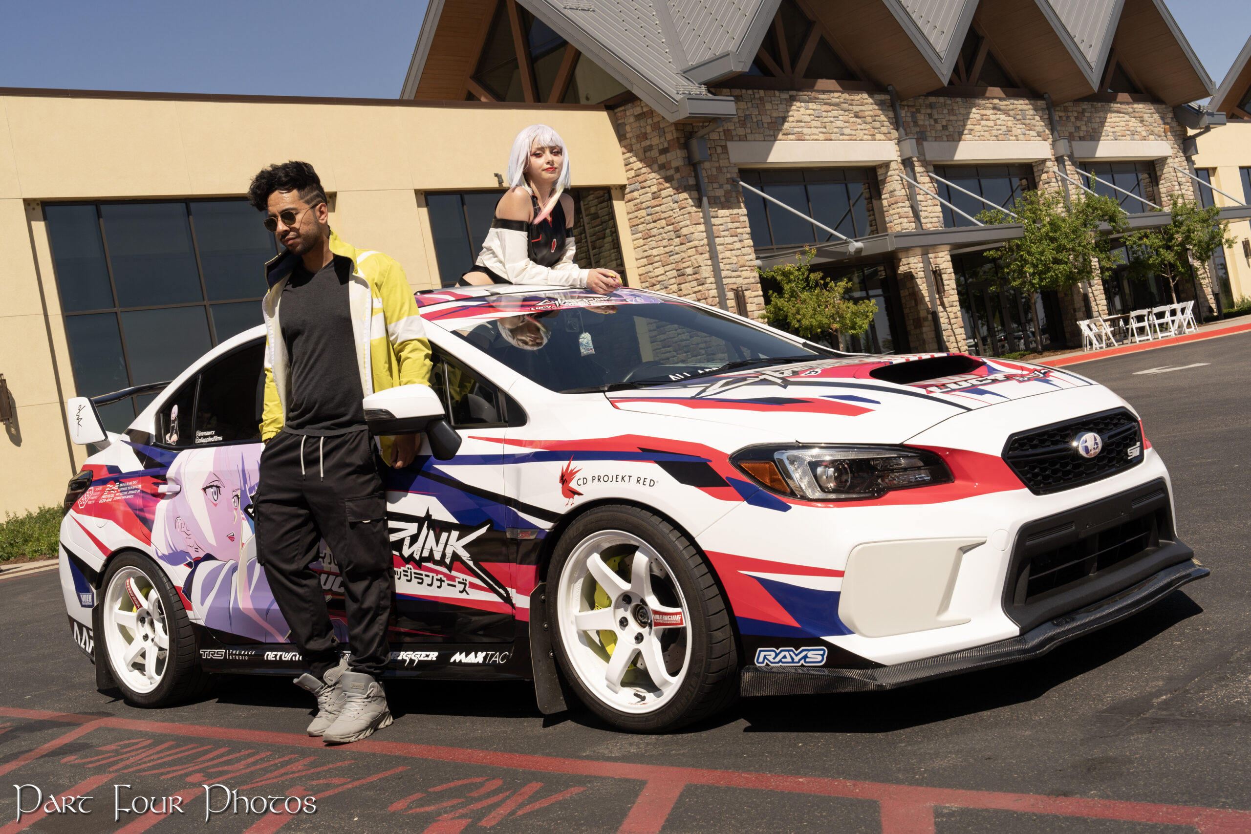 Subaru Impreza Sti with an itasha wrap in front of the Gayorld Convention Center